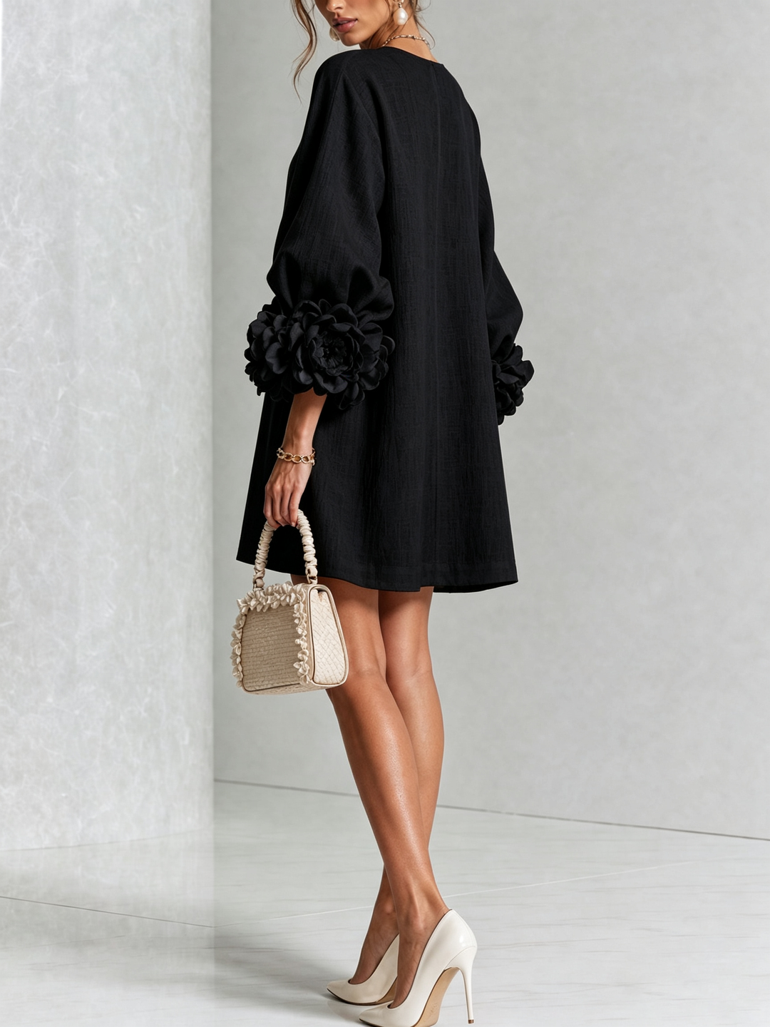 Black linen dress, another view, showing the plain back and large rose cuff on the sleeve.