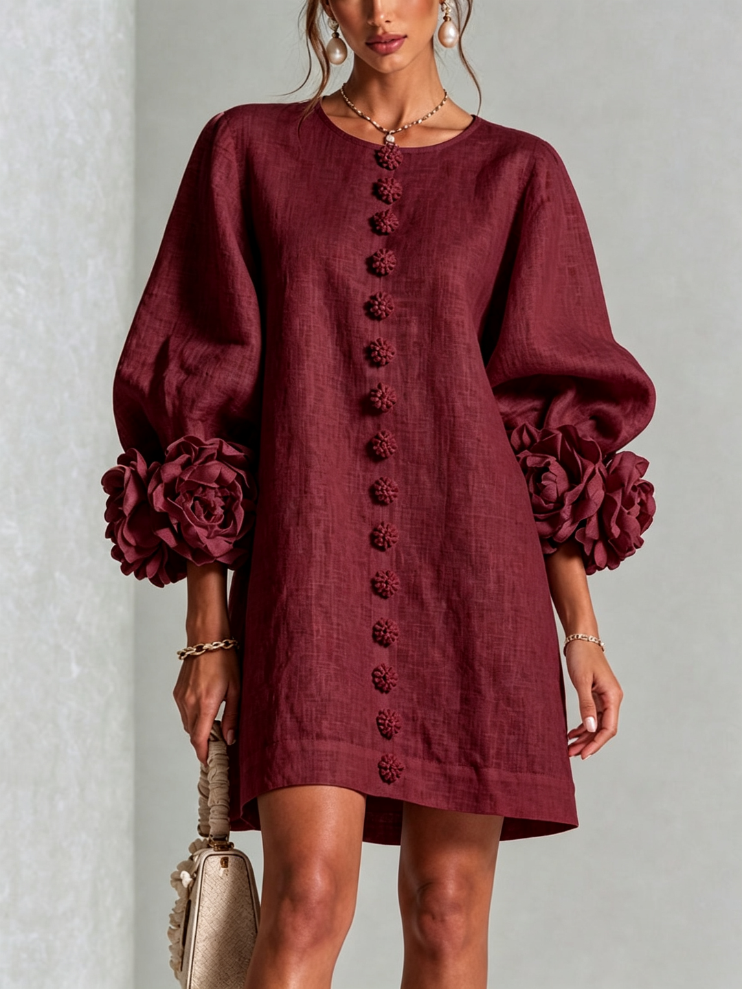 Front close-up of the burgundy dress with flower buttons down the front and rose cuffs 35