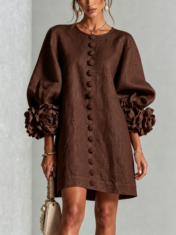 Front close-up of the chocolate brown dress with flower buttons and oversized rose cuffs 27