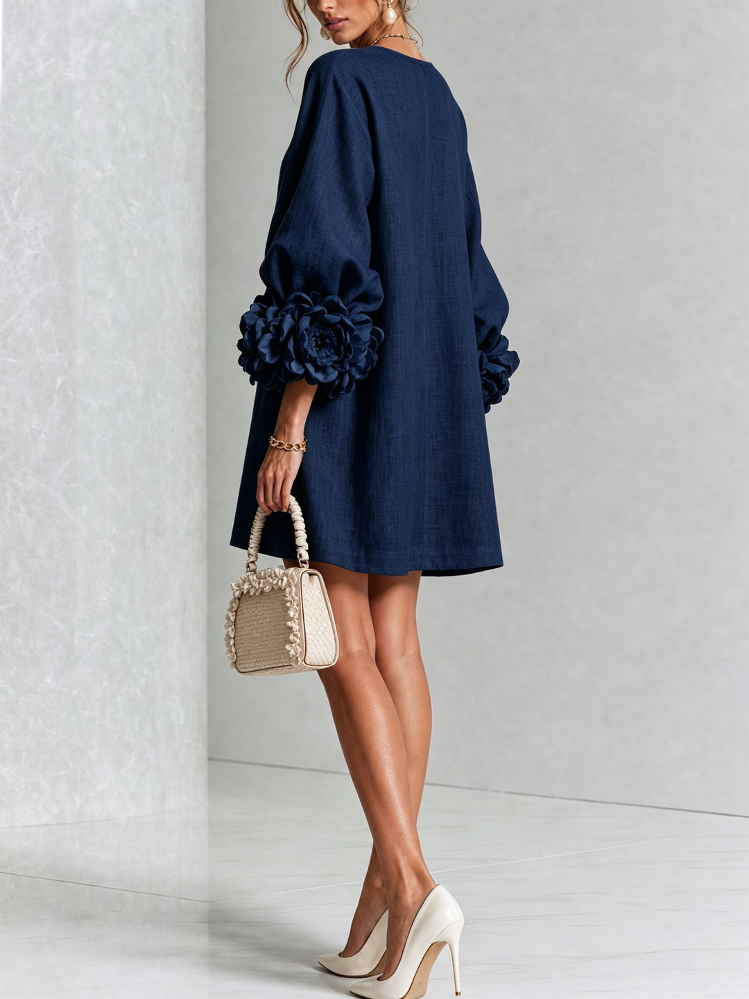 Navy blue dress another view with a plain back and flared hem.