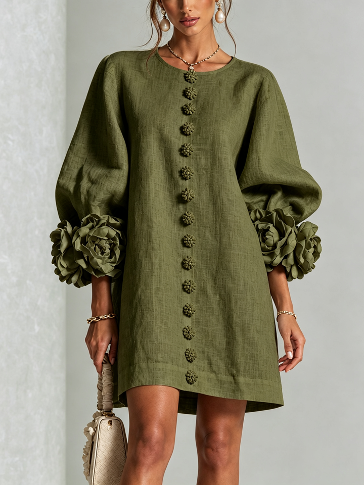 Olive green linen dress, front view, with matching flower buttons and rose-trimmed puffed sleeves.