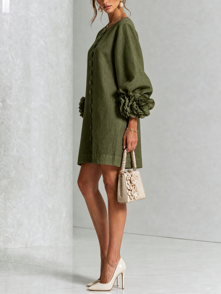Olive green mini dress, side detail with the puffed sleeve and button placket.