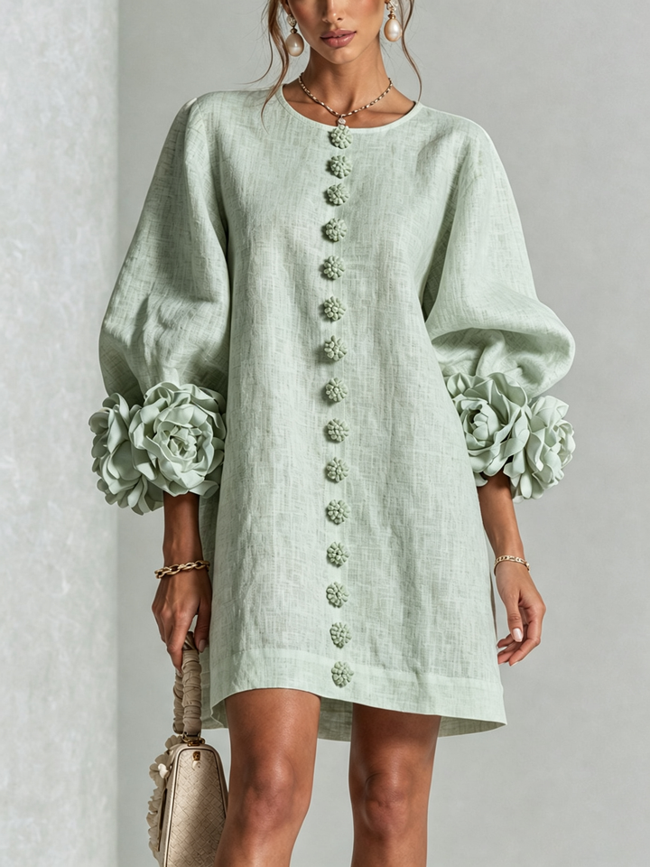 Front close-up of the mint green dress with flower buttons and large rose cuffs 31