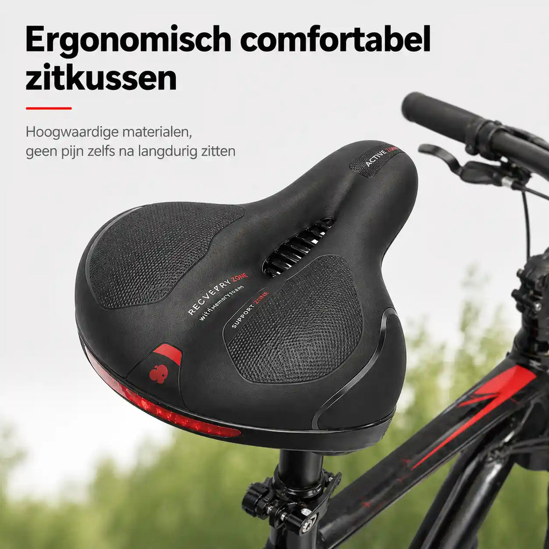Black and red bike saddle with a center cutout, mounted on a bike seatpost.