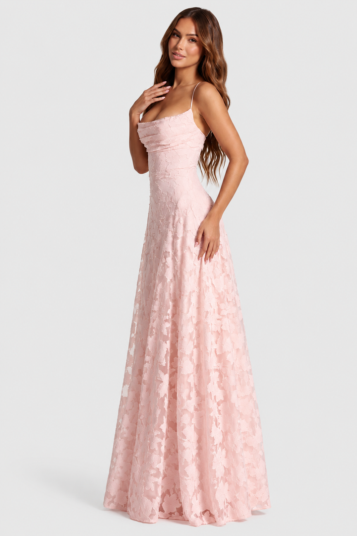 Pale pink raised floral lace dress with a draped neckline and thin straps, shown three-quarters.