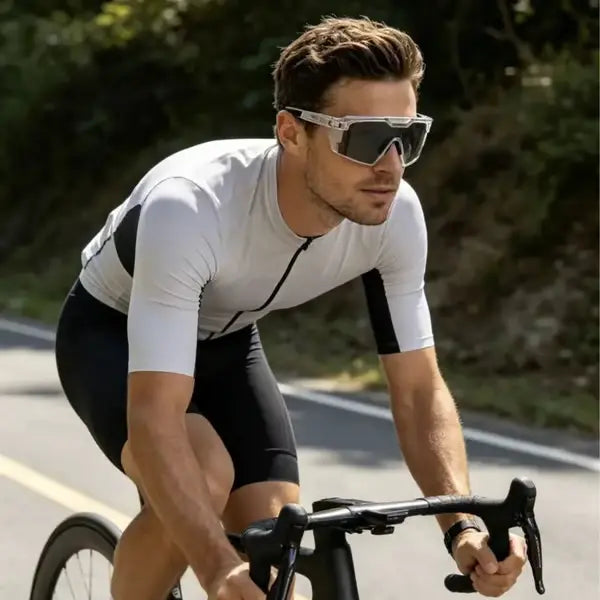 Black SunShift Tactical Sunglasses another view with darkened lenses on a cyclist.