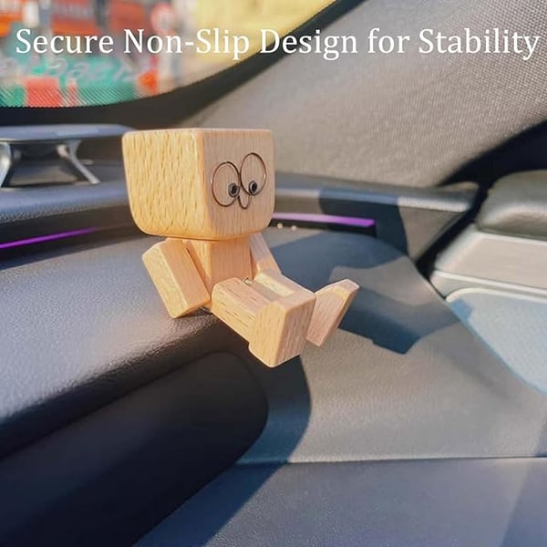Wooden figure with wire-ring eyes sits on a car dashboard, shown to illustrate its non-slip stability 12