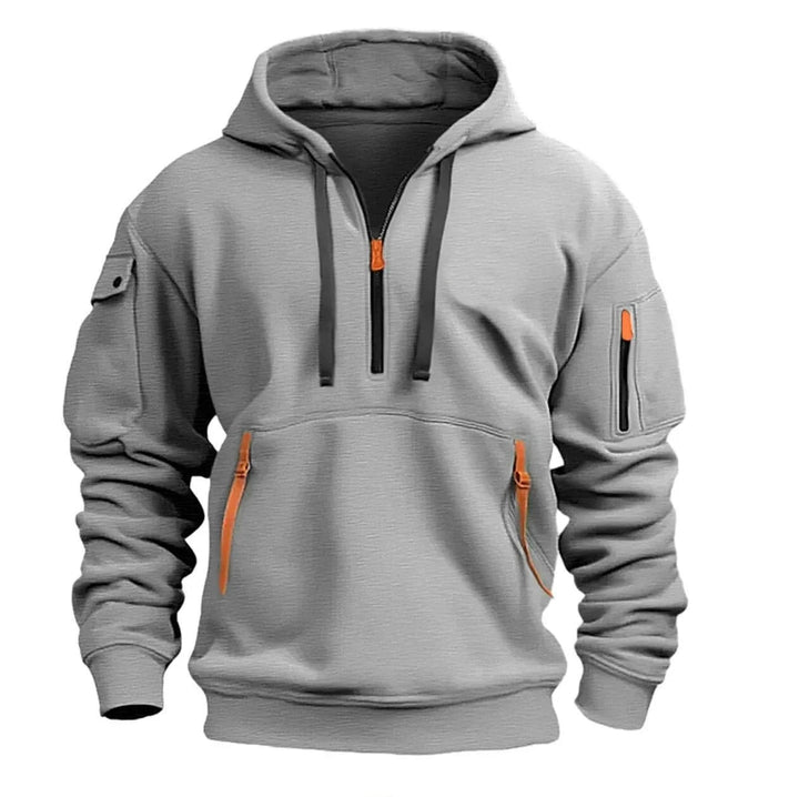 Light gray half-zip hoodie with orange zipper pulls, dark drawstrings, kangaroo pocket and sleeve pockets, front view 1