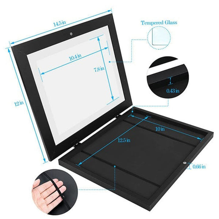 Black kids art frame detail with a dimensions diagram, tempered glass callout, and a hand stretching the elastic band inside.
