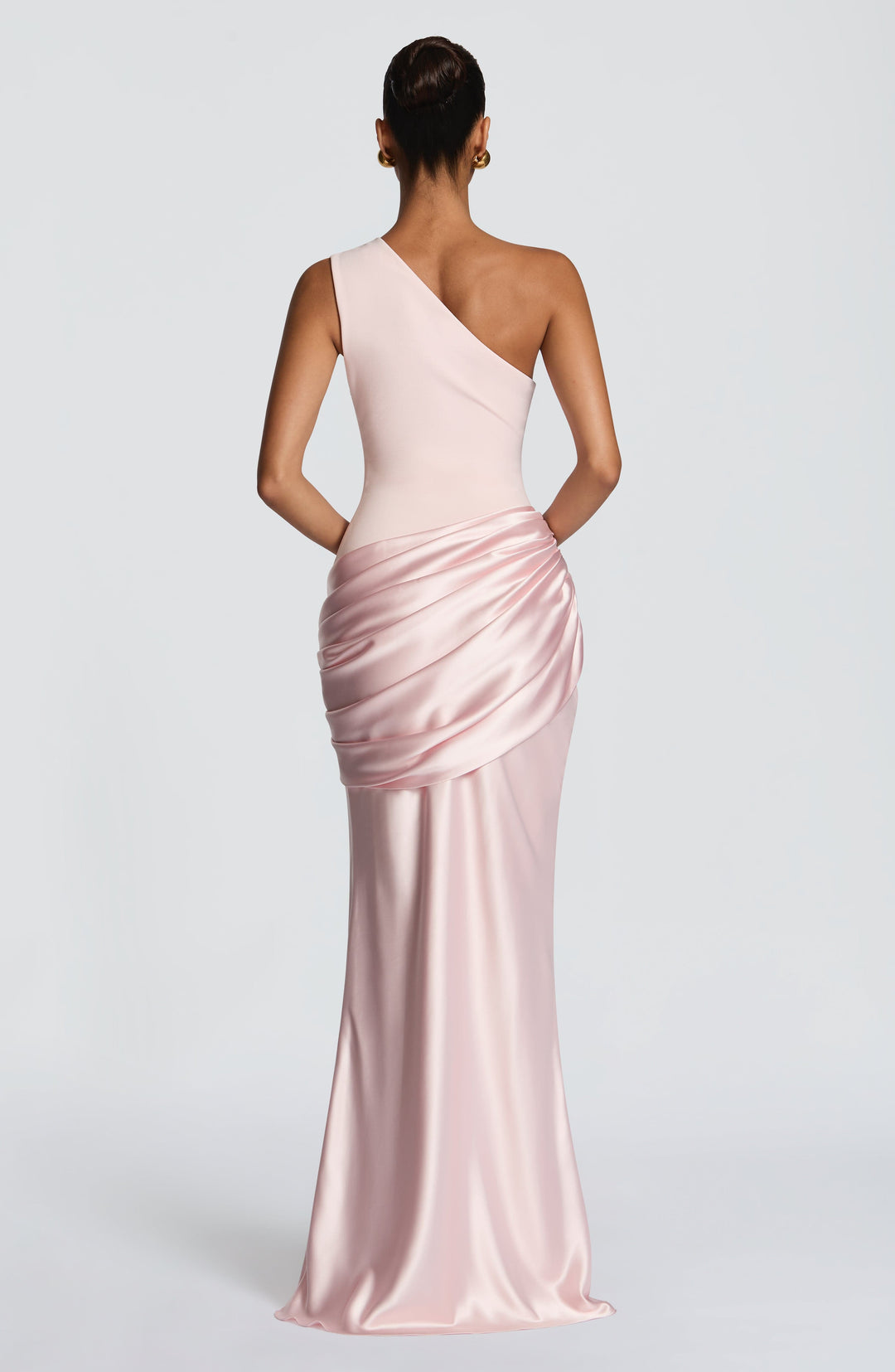 Back view of the pale pink gown, with the single wide strap and gathered satin drape at the hip. 14