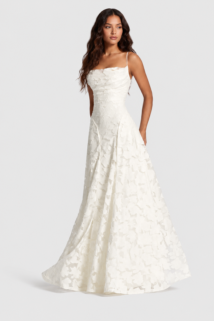 Ivory raised floral lace dress with a draped neckline and thin straps, shown from the front.
