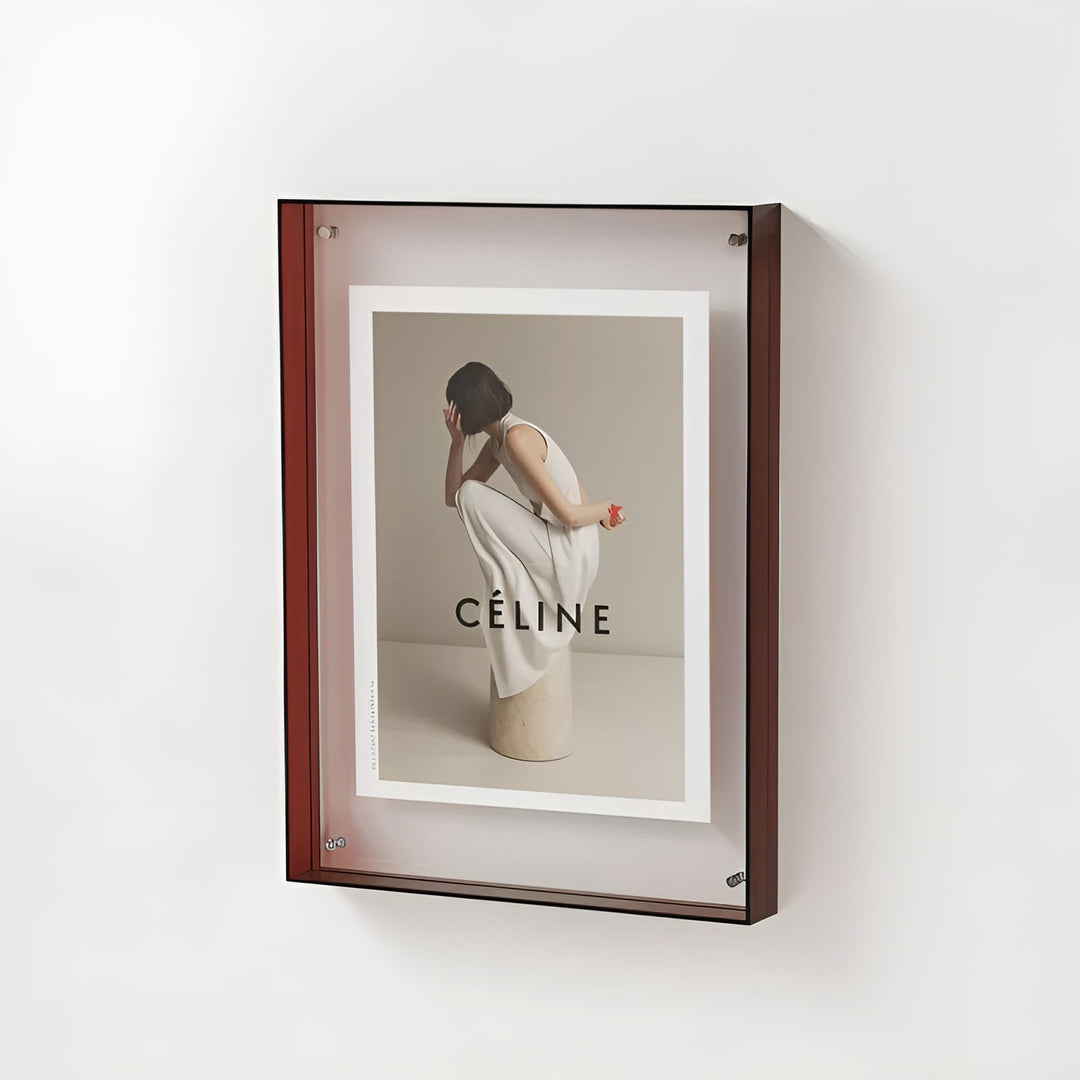 Dark red-brown acrylic frame mounted on a white wall.