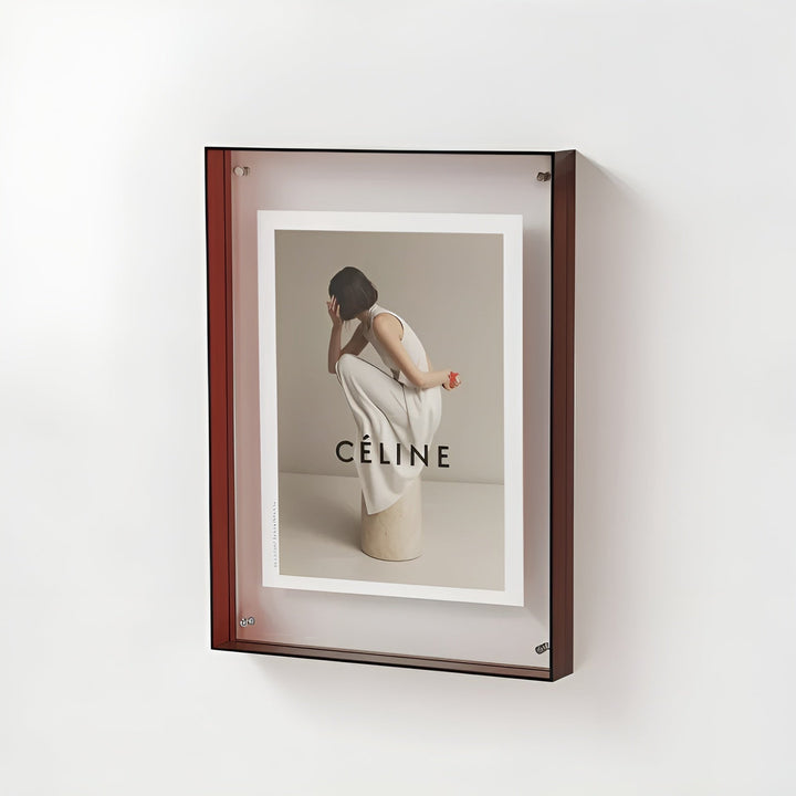 Dark red-brown acrylic frame mounted on a white wall.
