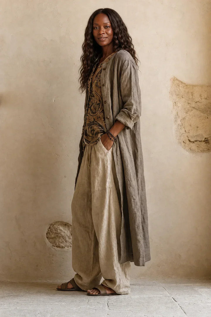 Side view of the model in the complete outfit, showing the long cardigan's drape and the pants' relaxed fit 4