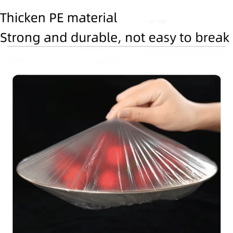 Detail of a thin clear cover stretched tightly over a plate of red food