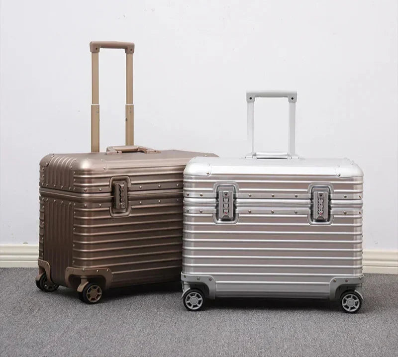 Champagne gold case and silver case standing together with handles extended against a white wall 7