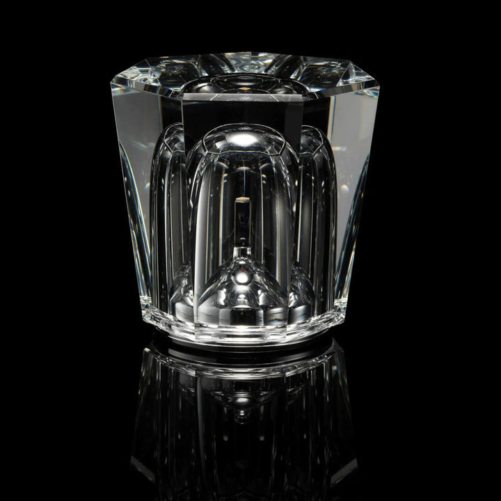 Gold transparent crystal table lamp, another view, switched off against a black background.