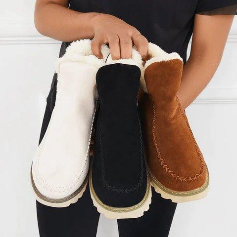 Three fleece-lined slip-on boots in cream, black and tan brown showing the color options.