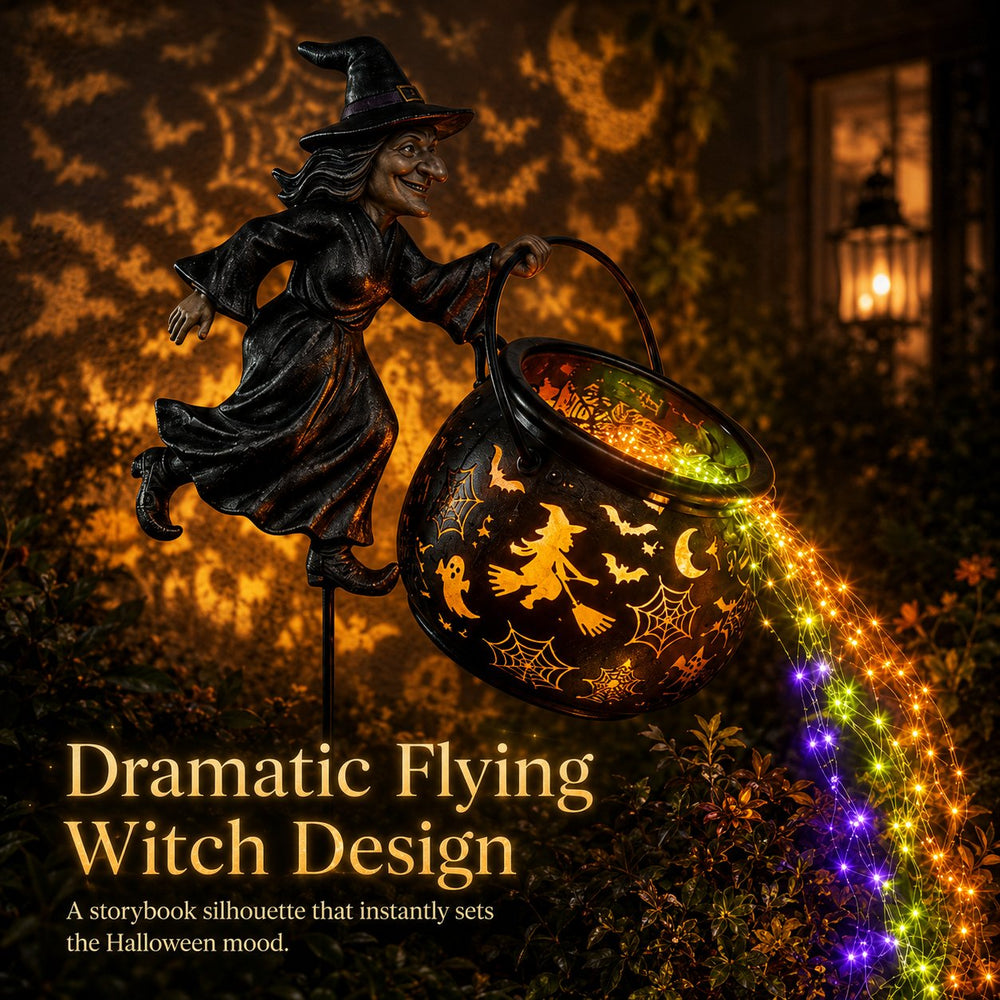 Close view of the dark witch figure tipping the cutout cauldron with colorful lights streaming out.