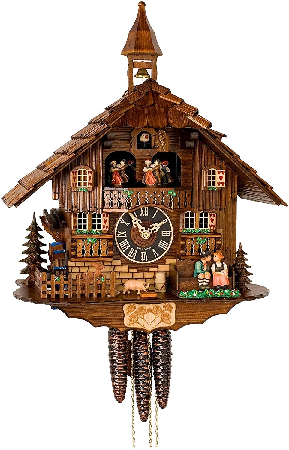 Dark wood chalet clock with bell tower, dancers, kissing couple, pig, fawn and three hanging pinecone weights 9
