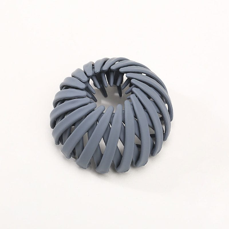 Twist-and-snap hair clip in slate blue-gray velvet shown from above.