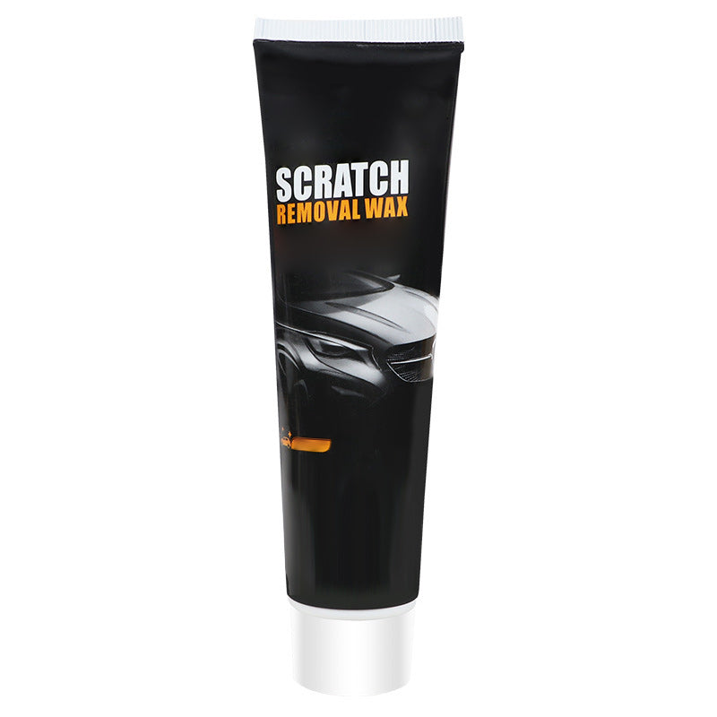 Front view of the black tube with a white cap, a dark car illustration and an orange accent, shown alone on a white background. 11
