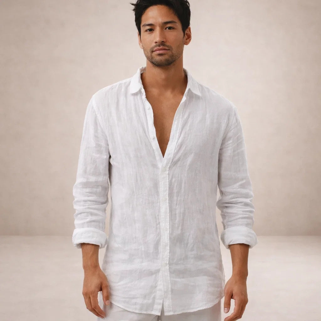 Model facing forward in the white linen shirt with open collar and rolled sleeves.