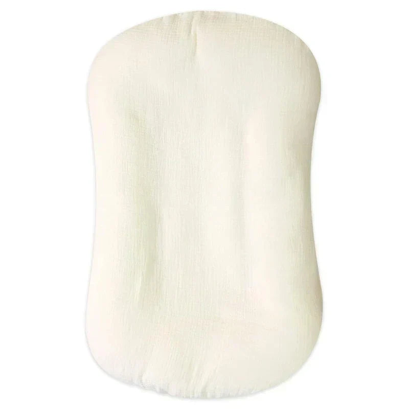Empty cream lounger with a crinkled gauze texture, seen from above 10