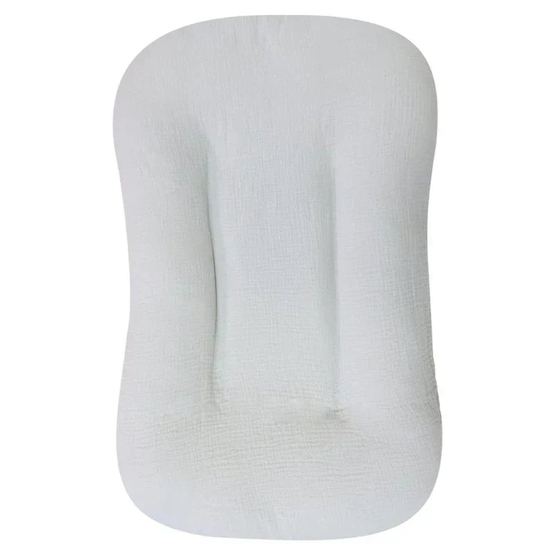 Empty pale gray crinkled-cotton lounger shown from above, with a padded center channel 10