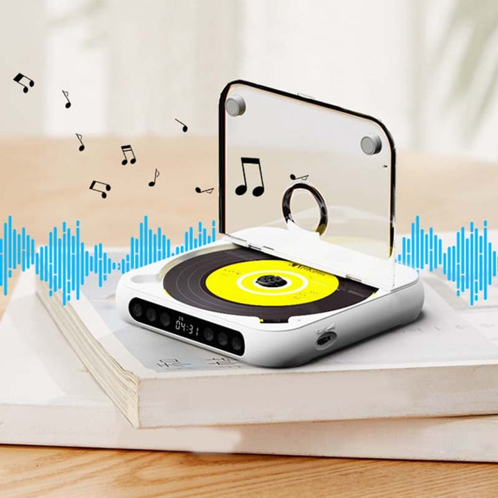 White CD player with open clear lid on stacked books, musical notes and blue sound waves around it 1