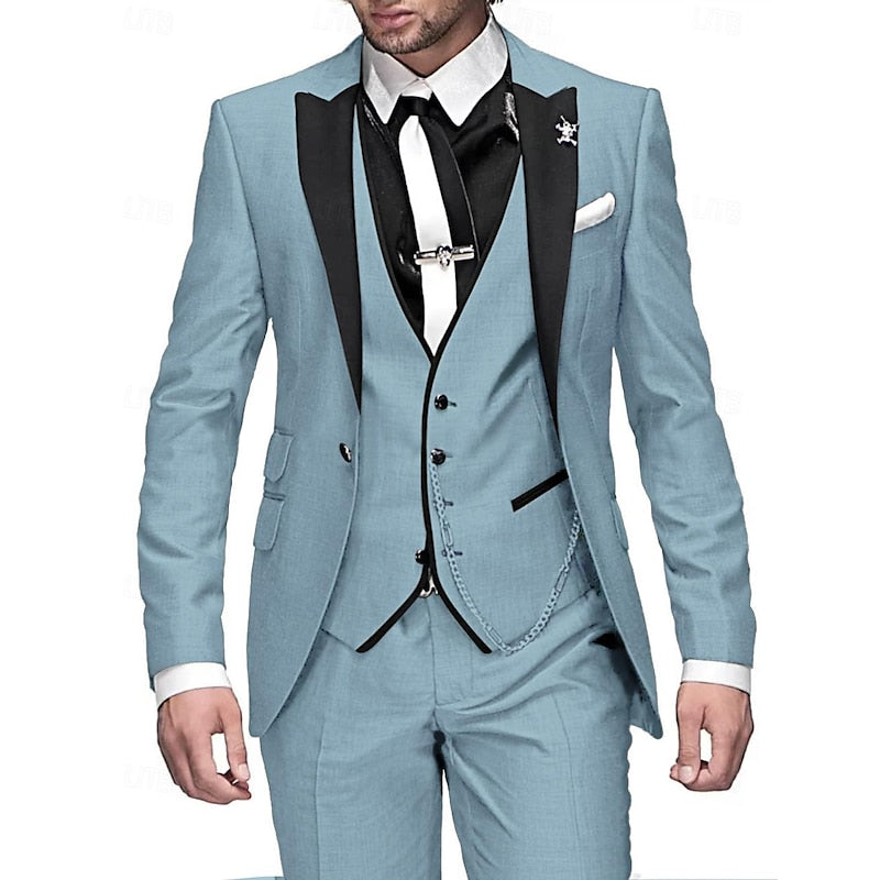 Men's three-piece suit in light blue with black peak lapels, black vest edging, white tie and white pocket square.