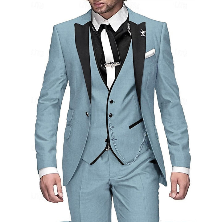 Men's three-piece suit in light blue with black peak lapels, black vest edging, white tie and white pocket square.