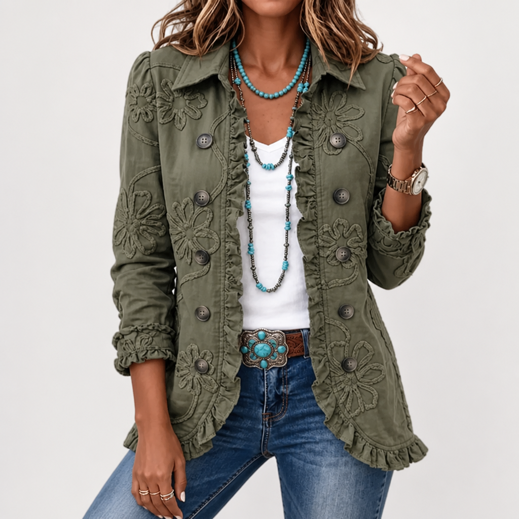 Green floral embroidered utility jacket detail with floral embroidery, ruffle trim and buttons styled with layered turquoise necklaces.