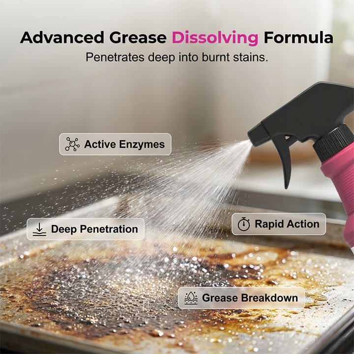 Black trigger sprayer misting cleaner over a baking sheet with burnt-on grease.