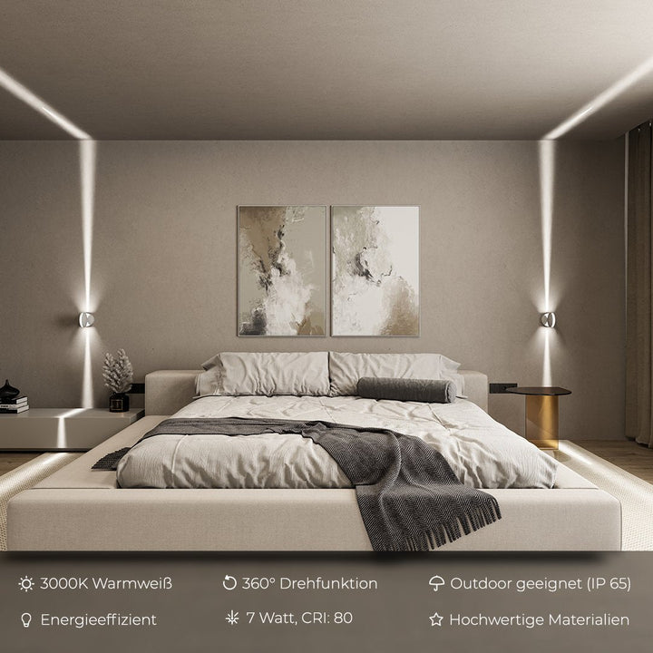 White LED wall sconce detail showing two fixtures by a bed casting vertical light beams.