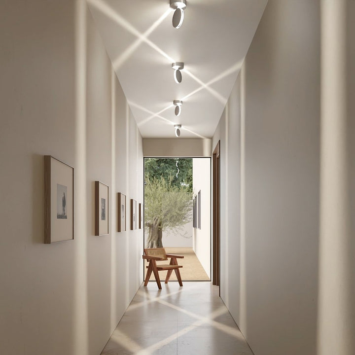 White LED wall sconce another view showing rotated spotlights casting X-shaped beams.