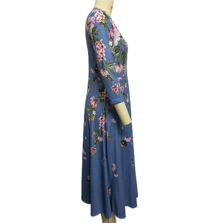 Blaues Damenkleid mit Blumenmuster, langärmelig, knielang, elegantes Design, Freizeitmode.