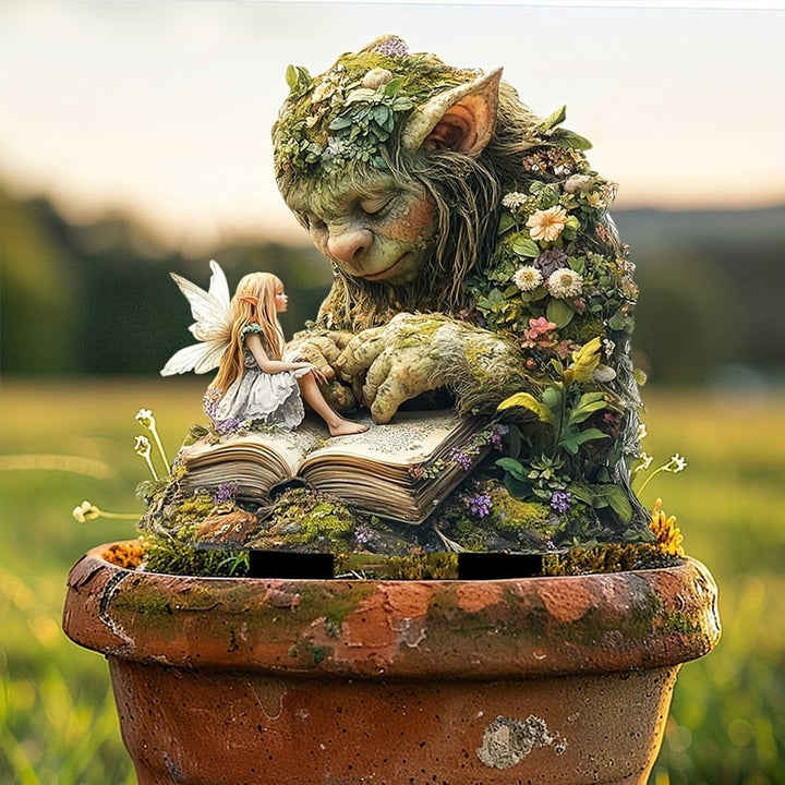 Fairy Tale Acrylic Garden Stake with a troll and fairy in a terracotta pot detail