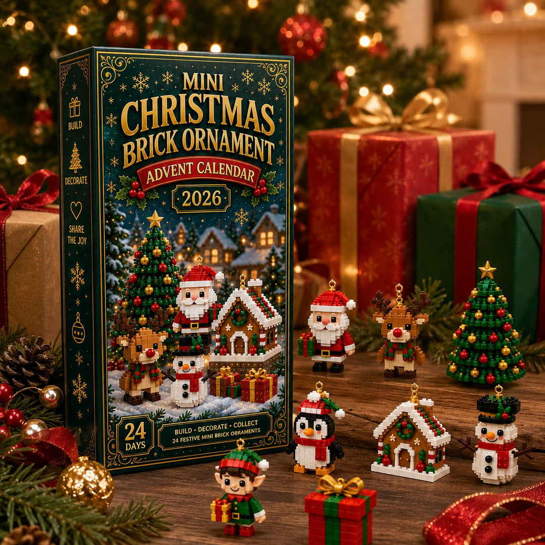 Box standing among wrapped gifts and pine branches, with a few finished ornaments in front: Santa, reindeer, tree, penguin, gingerbread house, snowman, elf and 