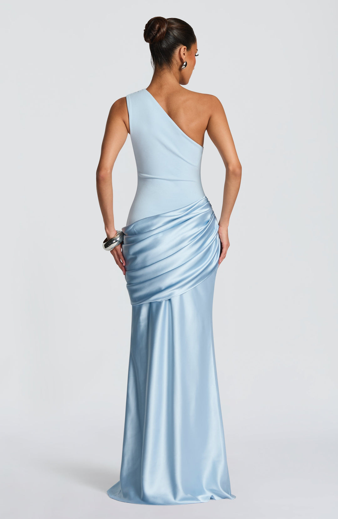Back view of the light blue gown, showing the asymmetric strap, smooth back and draped satin hip detail. 4