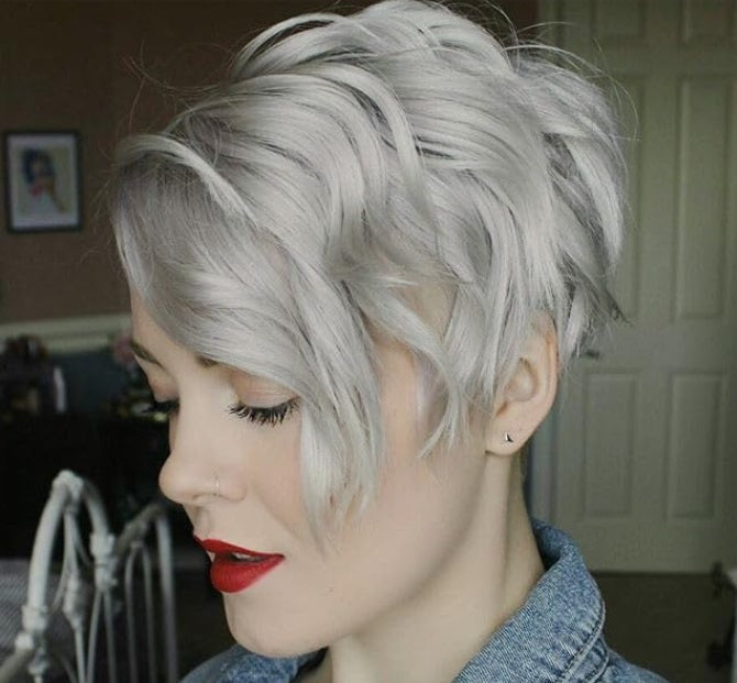 Another view of a short, tousled pixie cut in light silver-gray with a denim jacket.