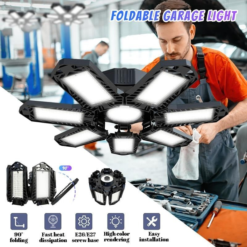Six-panel folding black LED garage light open above a mechanic working on a car, with small inset views of the folded panels. 1