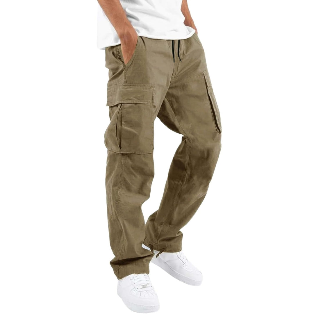 Model wearing taupe cargo pants with white tee and white sneakers, hand in pocket, angled side view. 3