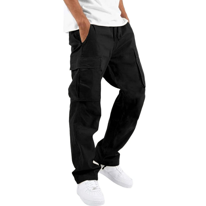 Model wearing black cargo pants with white tee and white sneakers, one hand in pocket, angled side view. 4
