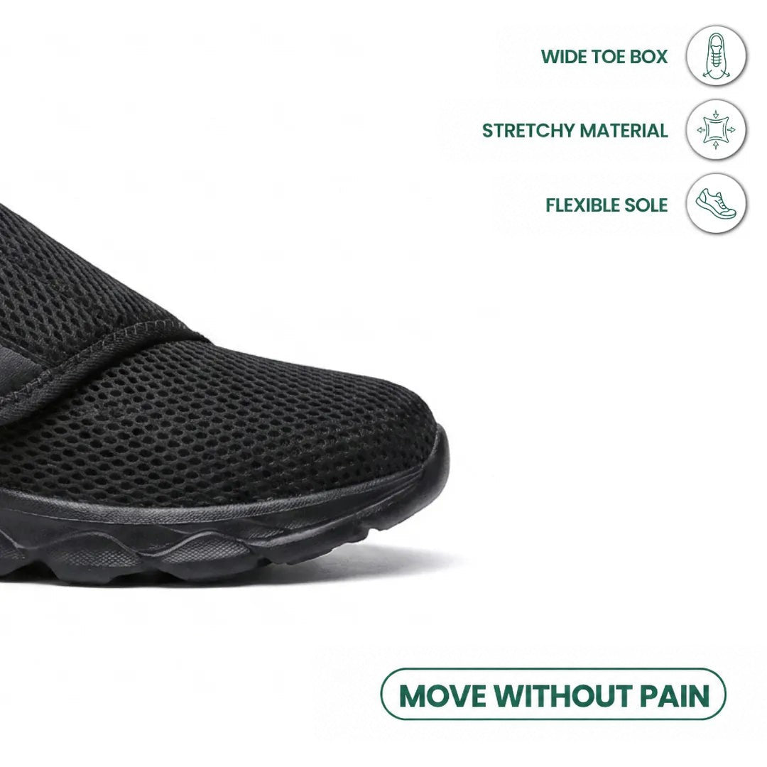 Close-up of the black shoe's wide toe box with icons about a roomy toe, stretch material and flexible sole 14