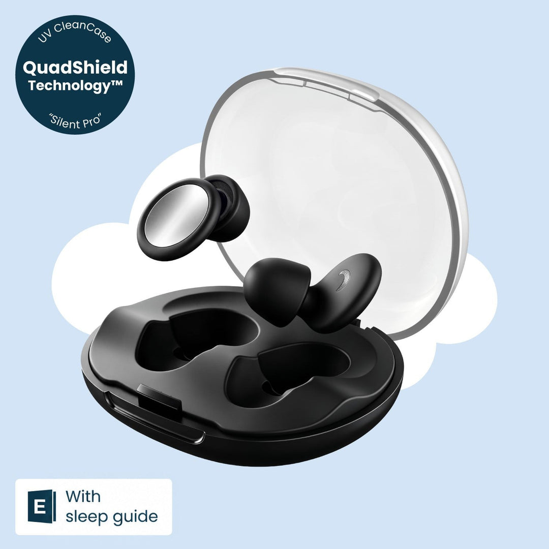 Pair of black earplugs with silver-toned outer discs above an open, clear-lidded charging case on a cloud background 1