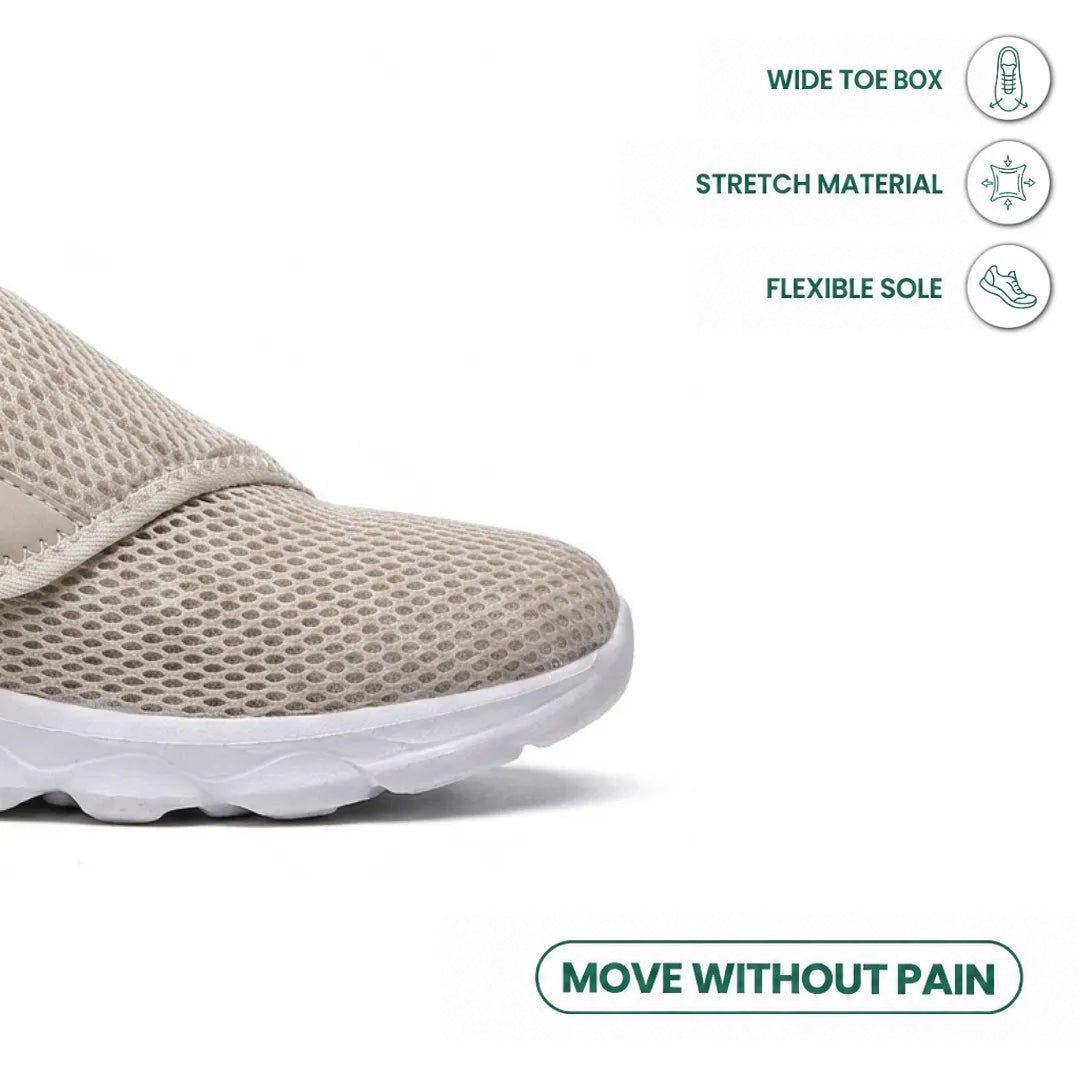 Close-up of the beige mesh toe box and strap, with icons for roomy toe, stretch material and flexible sole 32