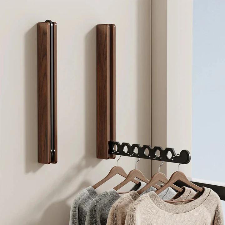 Foldable wooden wall coat rack another view with two walnut racks, one folded and one extended.