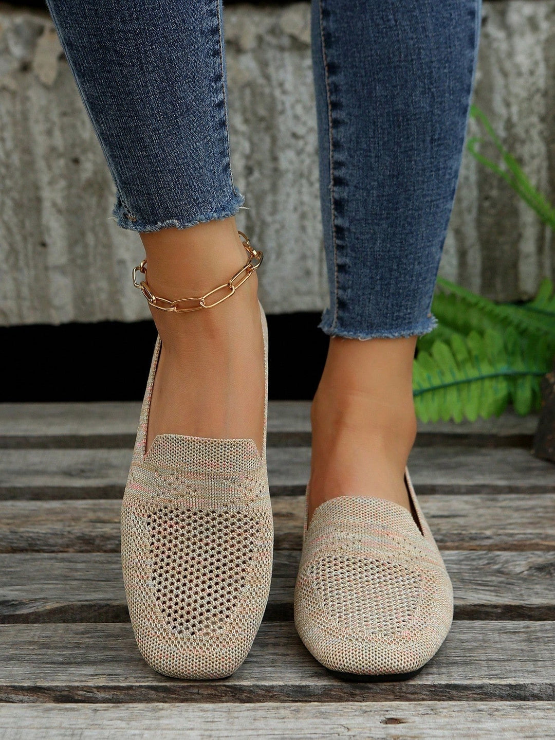 Beige knit slip-ons with pink flecks and open mesh toe, another view.
