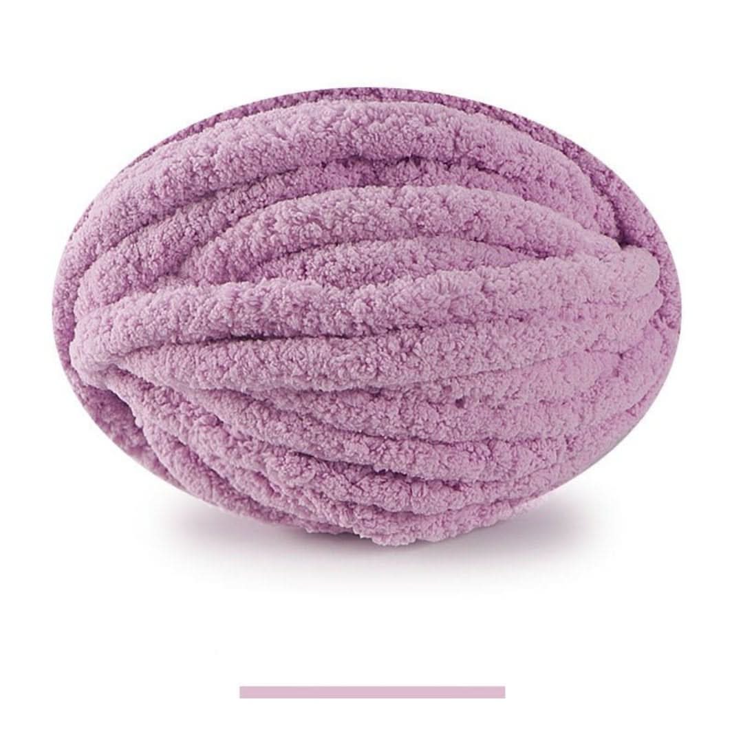 Oval ball of plush, fuzzy chunky yarn in a soft orchid purple, with a matching color swatch bar below. 21